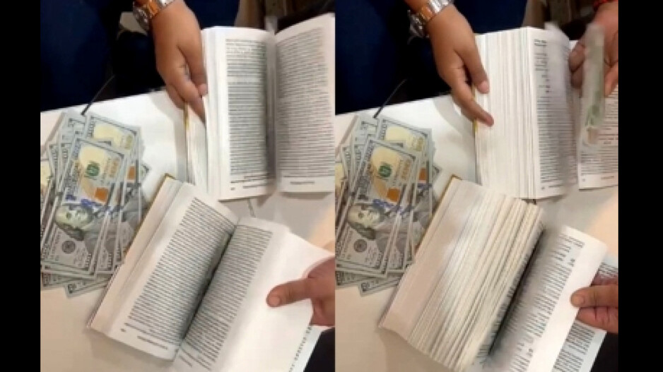 US Dollar hidden between book