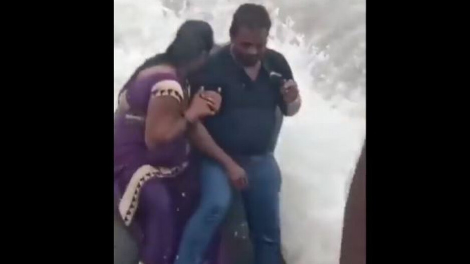 Woman swept away by wave