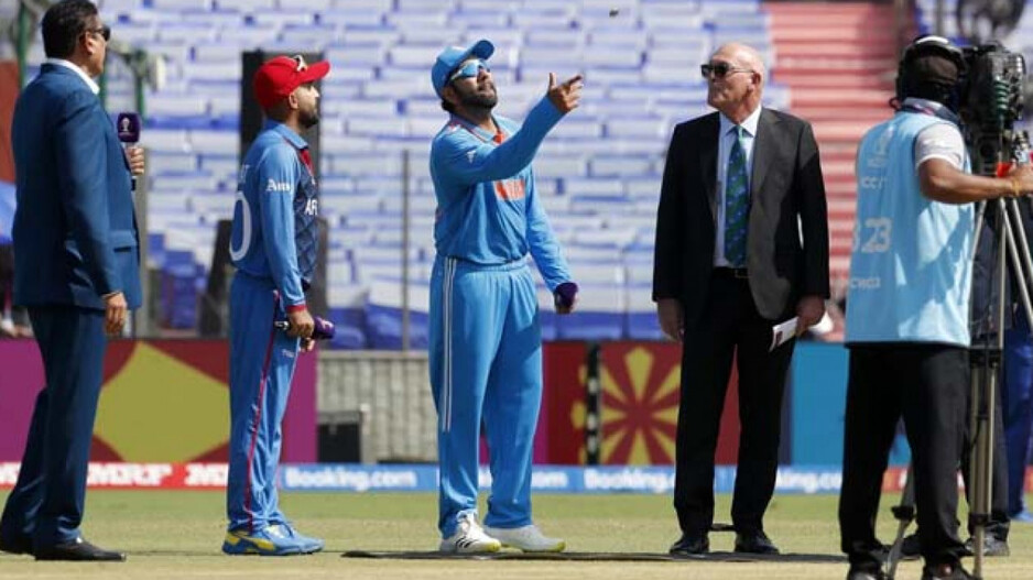 Rohit Sharma tosses the coin up