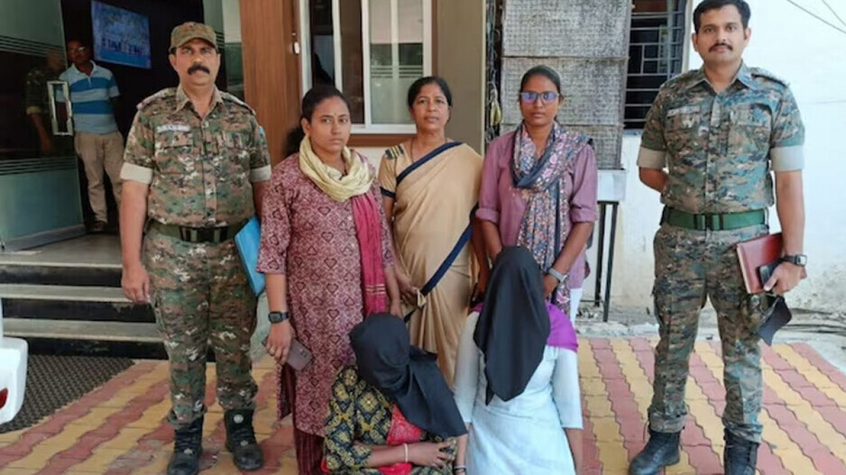 Police With Arrested Two Women 