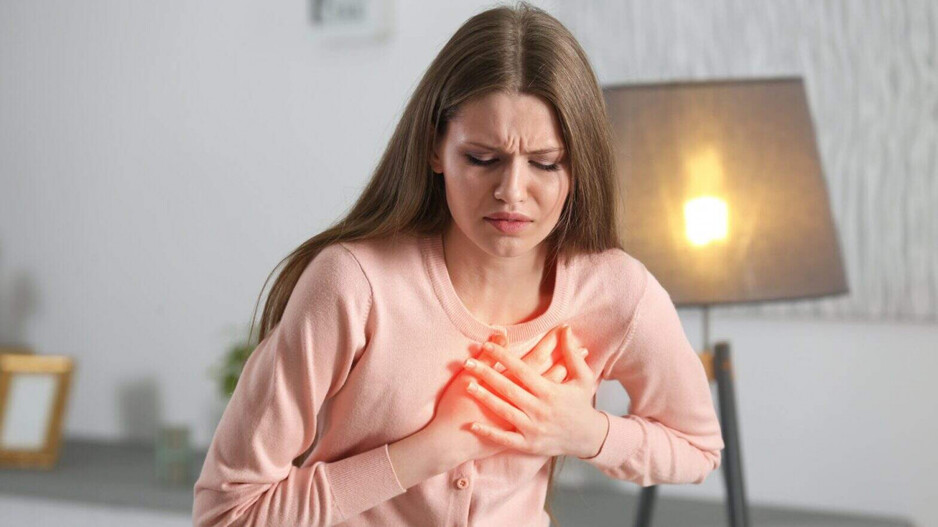 An woman feeling chest pain 