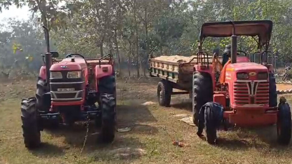 2 illegal sand loading tractors