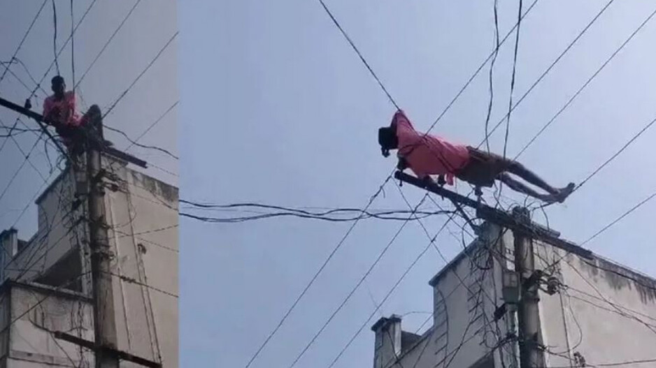 Man Climb Electric Pole