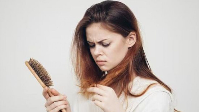 Woman combing hair 