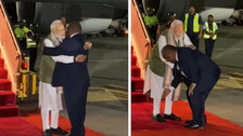 Papua New Guinea PM James Marape receives PM Modi at the airport. He touched Modi's feet