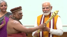 One of the adheenam priests with Finance Minister Nirmala Sitharaman, and PM Modi in Delhi