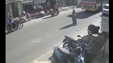 Woman jumps in front of bus