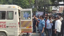 People gathering in front of hospital 