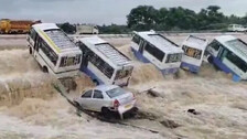 Buses Swept Away By Flood Waters