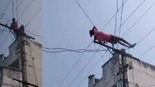 Man Climb Electric Pole