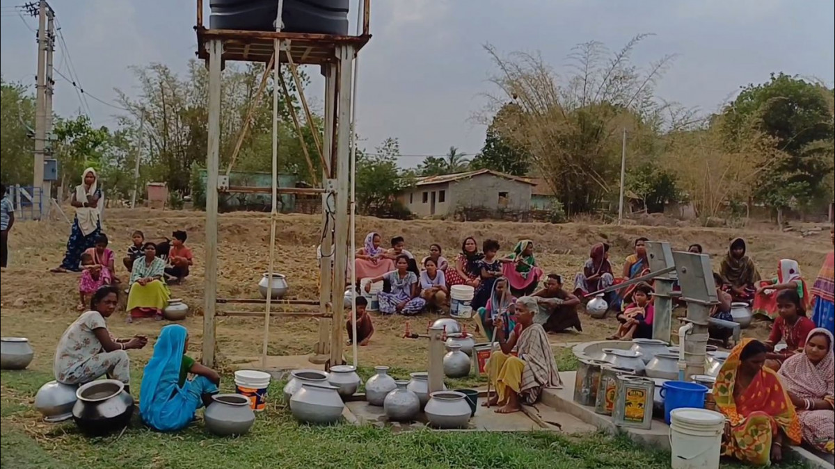 People gathered near solar water project for collect drinking water