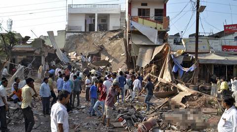 People stand near the site of an explosion in Jhabua district at Madhya Pradesh