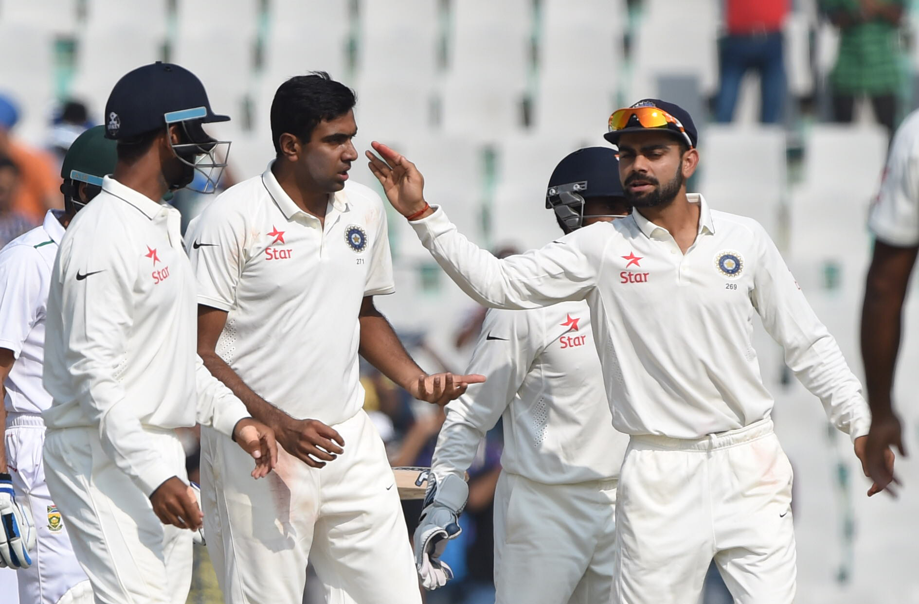 Indias-captain-Virat-Kohli-R-congratulates-teammate3