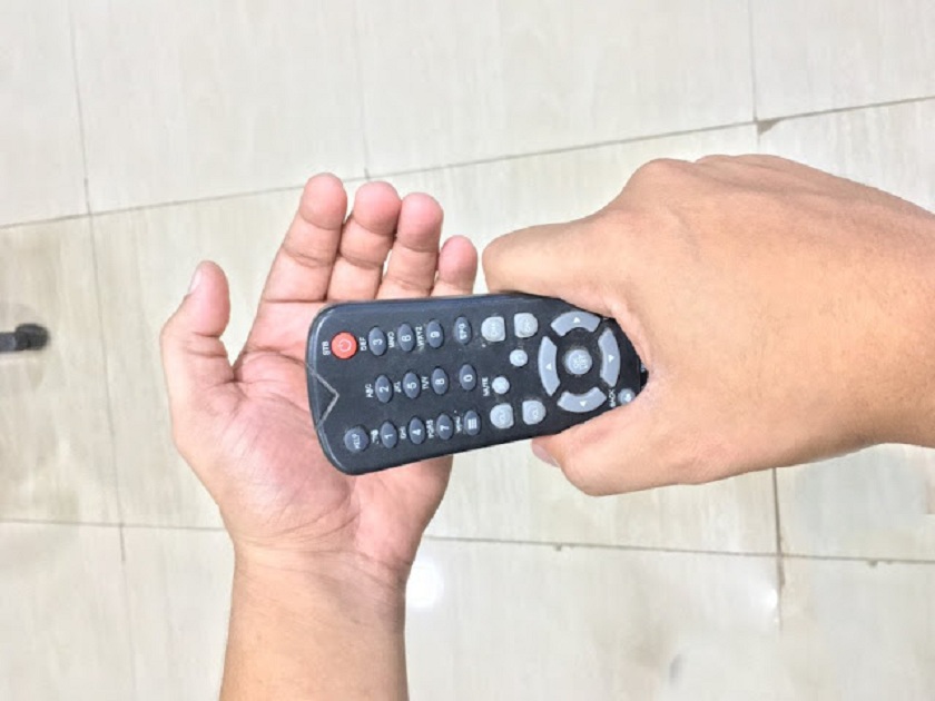 TV-remote-smacking-on-hand