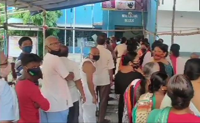 Voters queue outside polling booth